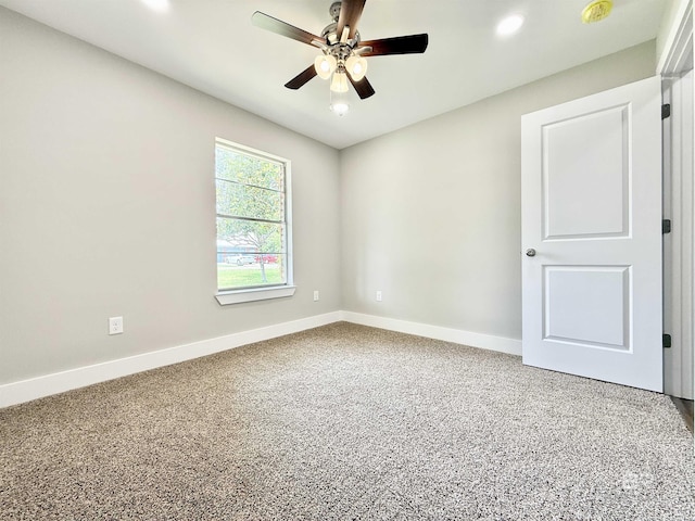 spare room with carpet, ceiling fan, recessed lighting, and baseboards