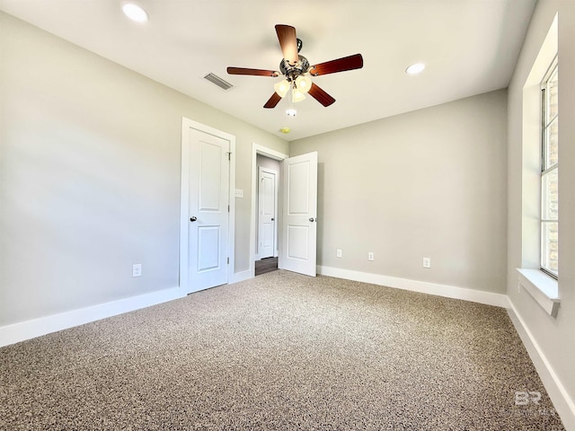 unfurnished bedroom with recessed lighting, visible vents, carpet floors, and baseboards