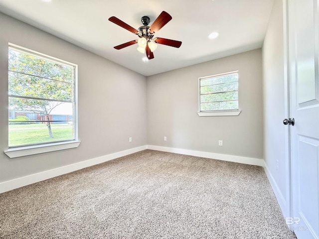 unfurnished room featuring baseboards, a ceiling fan, and carpet floors
