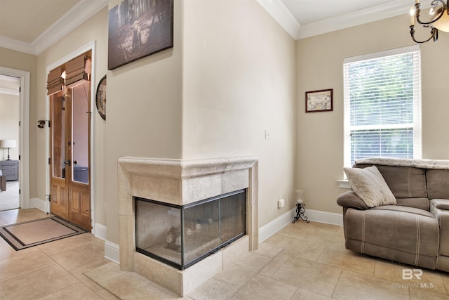 interior space with baseboards, ornamental molding, light tile patterned flooring, and a tile fireplace