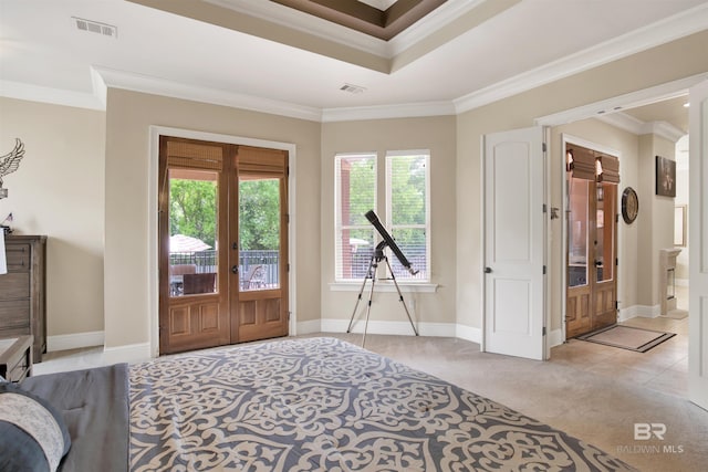 entryway with a healthy amount of sunlight, ornamental molding, and french doors