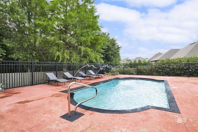 view of swimming pool with fence, a fenced in pool, and a patio area