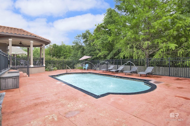 view of swimming pool with fence, a fenced in pool, and a patio area