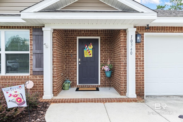 view of exterior entry featuring a garage