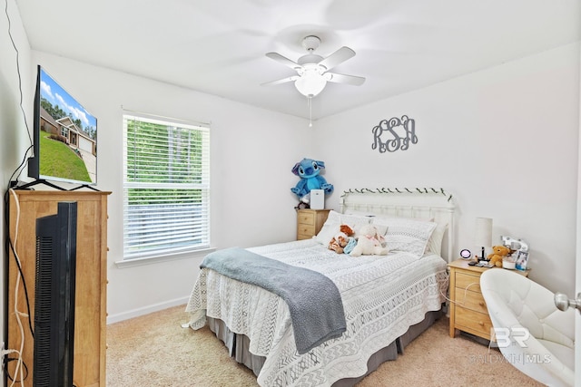 carpeted bedroom featuring ceiling fan