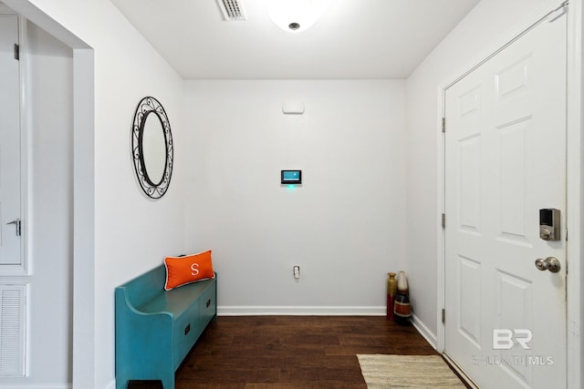 unfurnished room with dark wood-type flooring