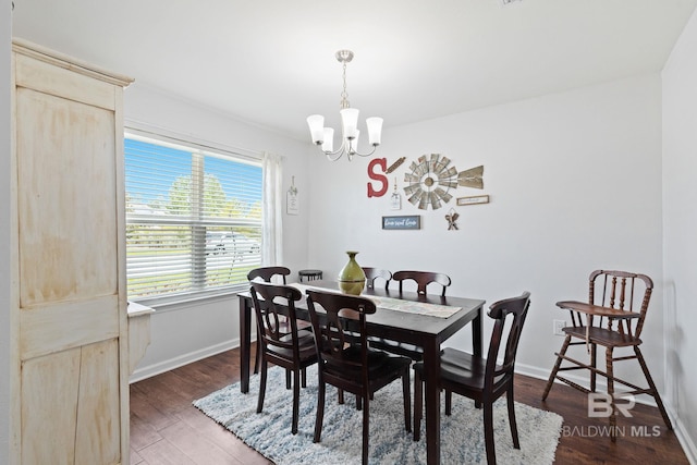 dining room featuring dark hardwood / wood-style floors and a notable chandelier