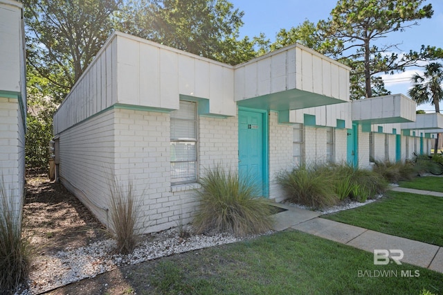 325 E 22nd Ave Unit 13, Gulf Shores, AL 36542 - view of front facade with brick siding