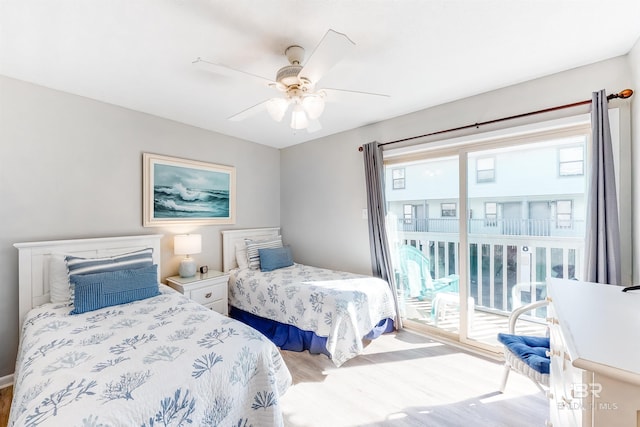 bedroom with hardwood / wood-style floors, ceiling fan, access to outside, and multiple windows