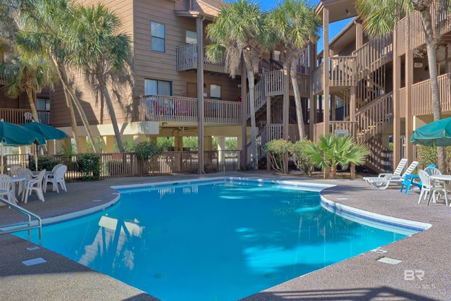 view of swimming pool with a patio