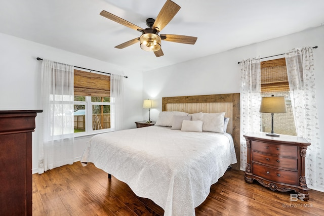 bedroom featuring wood-type flooring and ceiling fan