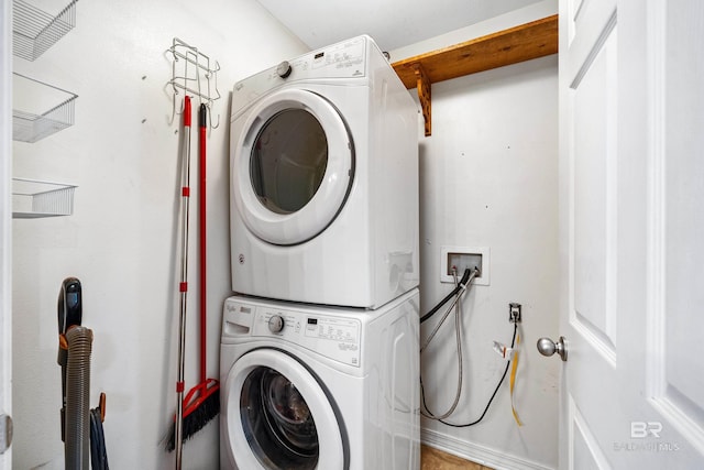 laundry area featuring stacked washer and clothes dryer