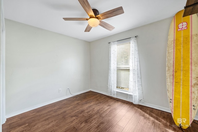 unfurnished room featuring ceiling fan and dark hardwood / wood-style flooring