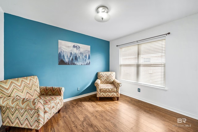 sitting room featuring hardwood / wood-style floors