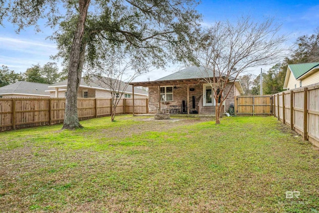 view of yard with an outdoor fire pit