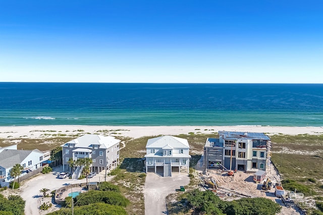 aerial view featuring a view of the beach and a water view