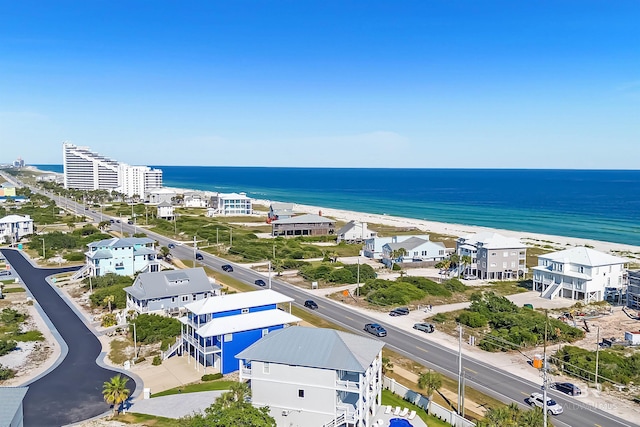 drone / aerial view featuring a water view and a view of the beach