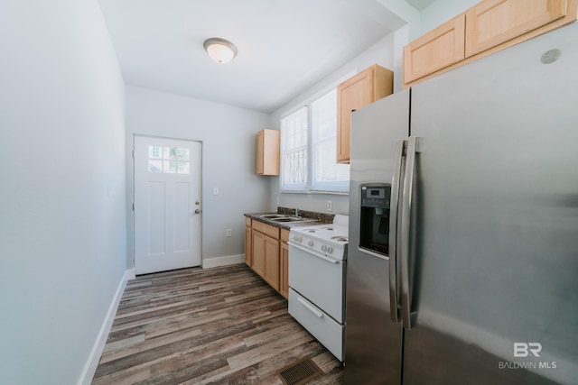 kitchen featuring stainless steel fridge with ice dispenser, white stove, dark hardwood / wood-style floors, light brown cabinetry, and sink