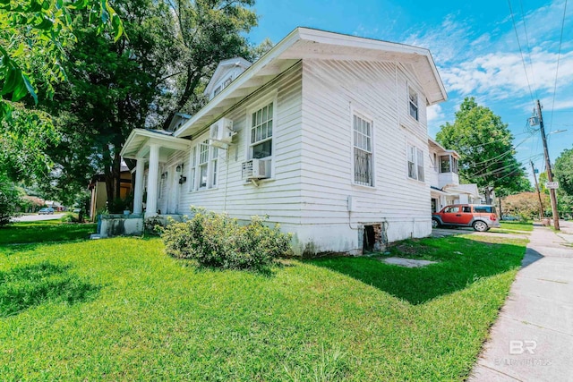 view of home's exterior with a lawn