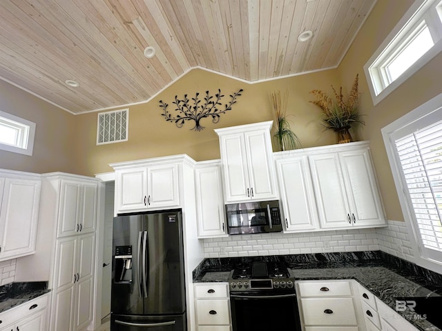 kitchen featuring appliances with stainless steel finishes, backsplash, and wooden ceiling