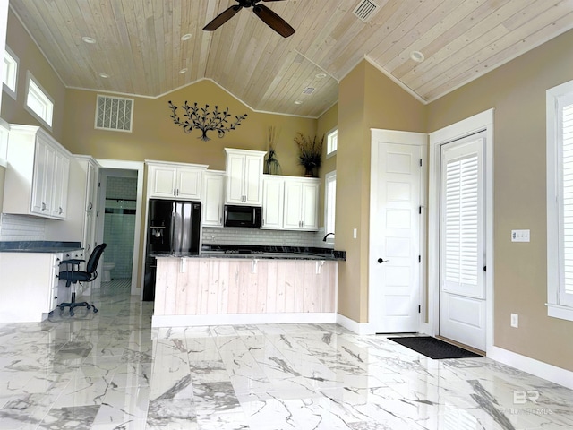 kitchen with white cabinets, backsplash, wooden ceiling, and black appliances