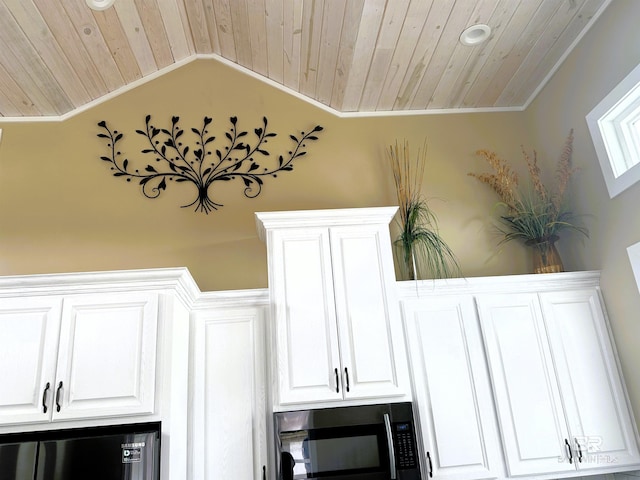 details featuring white cabinets, wooden ceiling, and crown molding