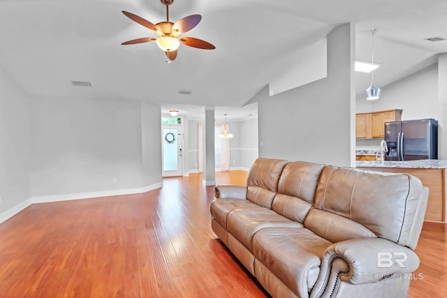 27913 Turkey Branch Dr, Daphne, AL 36526 - living area featuring a ceiling fan, light wood finished floors, and lofted ceiling