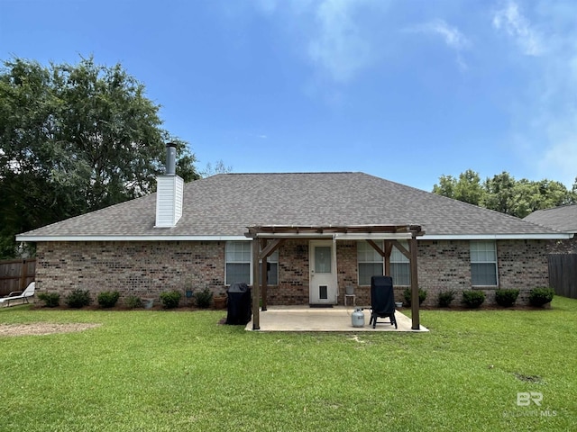 27913 Turkey Branch Dr, Daphne, AL 36526 - back of property with a patio area, brick siding, a chimney, and a shingled roof