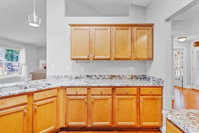 27913 Turkey Branch Dr, Daphne, AL 36526 - kitchen featuring light stone countertops, light wood-style floors, and pendant lighting