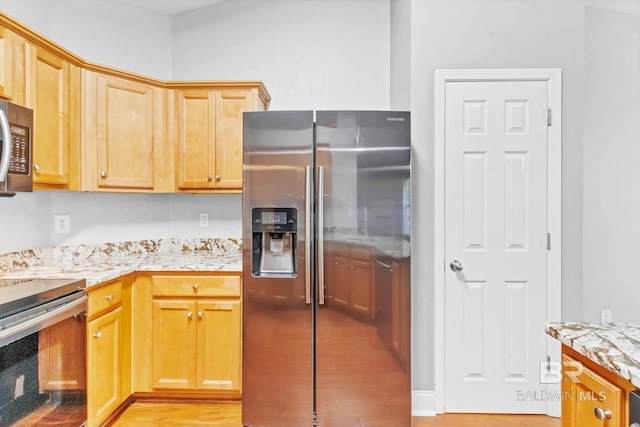 27913 Turkey Branch Dr, Daphne, AL 36526 - kitchen with stainless steel appliances, light stone countertops, and light wood-type flooring
