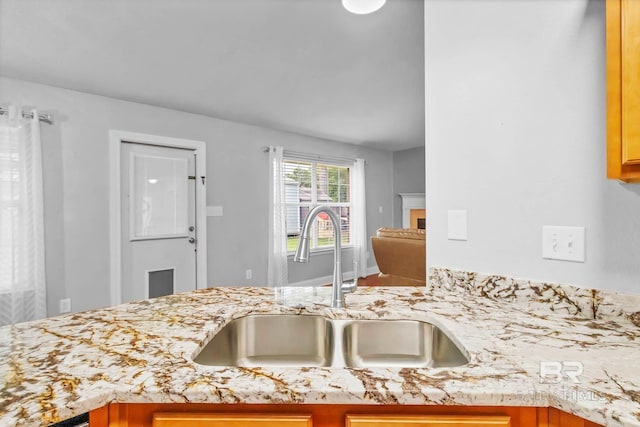 27913 Turkey Branch Dr, Daphne, AL 36526 - kitchen featuring a fireplace and light stone counters