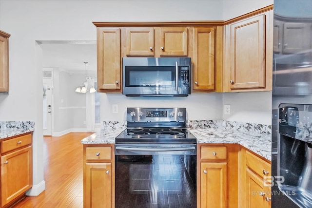 27913 Turkey Branch Dr, Daphne, AL 36526 - kitchen with appliances with stainless steel finishes, light wood-style flooring, light stone countertops, and a chandelier