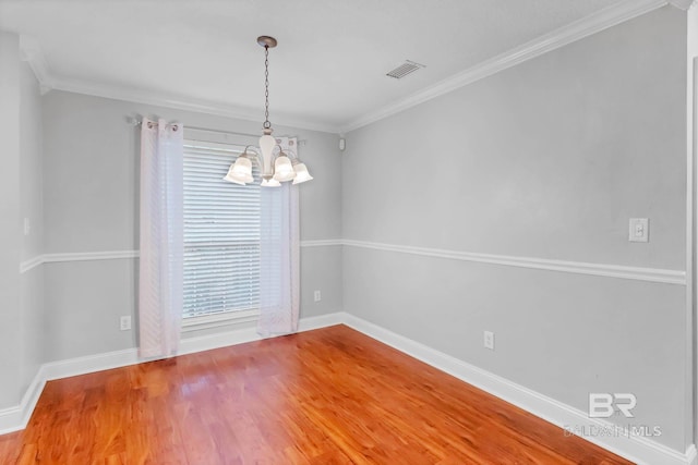 27913 Turkey Branch Dr, Daphne, AL 36526 - spare room with a chandelier, wood finished floors, and ornamental molding