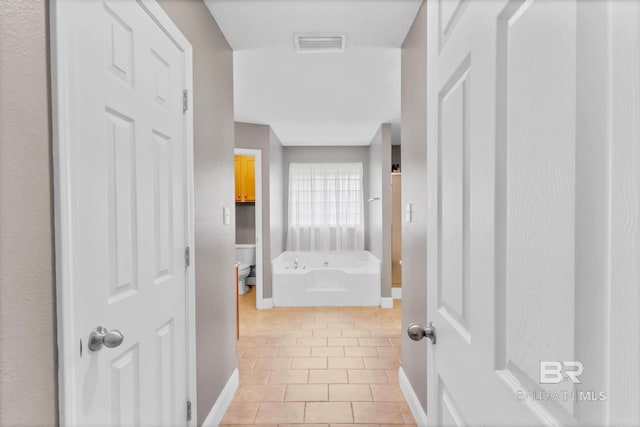 27913 Turkey Branch Dr, Daphne, AL 36526 - hallway featuring baseboards and light tile patterned floors
