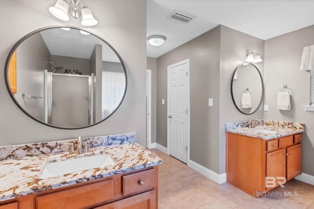 27913 Turkey Branch Dr, Daphne, AL 36526 - full bath featuring two vanities, a stall shower, and tile patterned floors