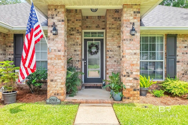 27913 Turkey Branch Dr, Daphne, AL 36526 - entrance to property with roof with shingles, brick siding, and a porch