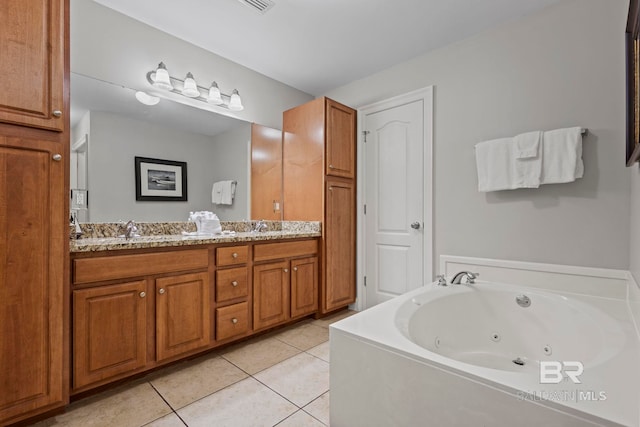 bathroom with a whirlpool tub, double vanity, a sink, and tile patterned flooring