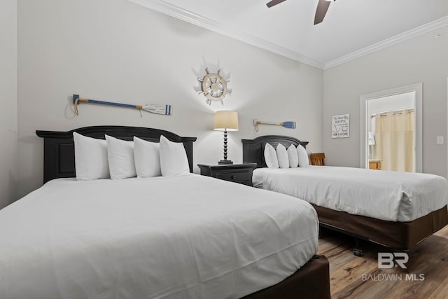 bedroom with ceiling fan, ornamental molding, and wood finished floors