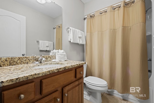 bathroom with toilet, curtained shower, and vanity