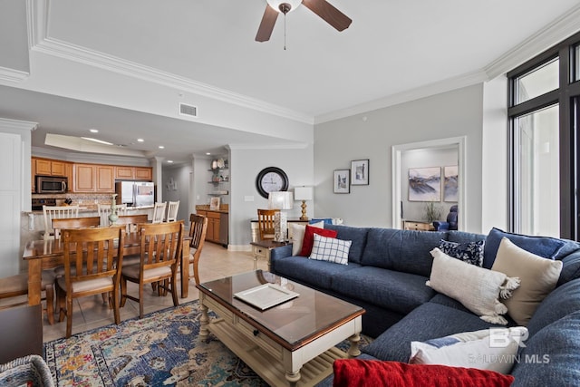 living room with light tile patterned floors, visible vents, ceiling fan, crown molding, and recessed lighting