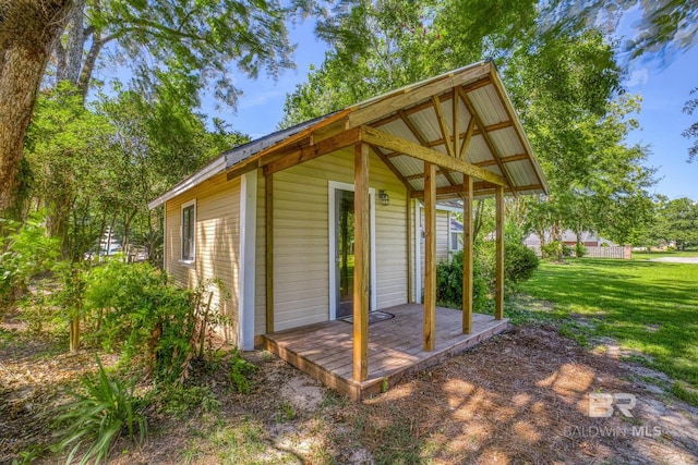 view of outdoor structure with a lawn