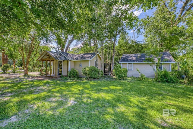 rear view of property with a lawn