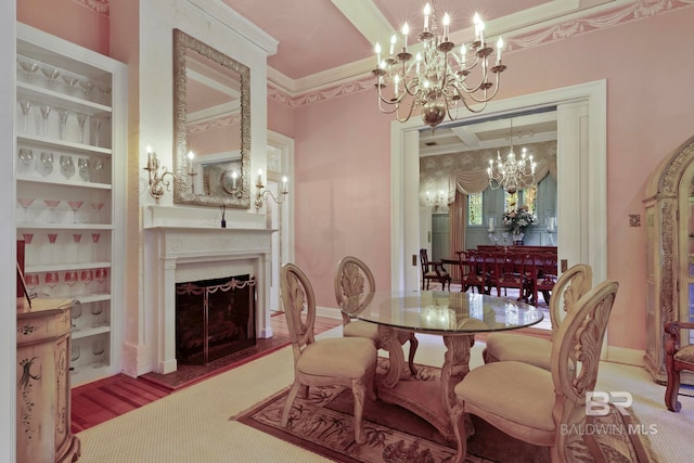 dining room featuring carpet flooring, ornamental molding, and an inviting chandelier