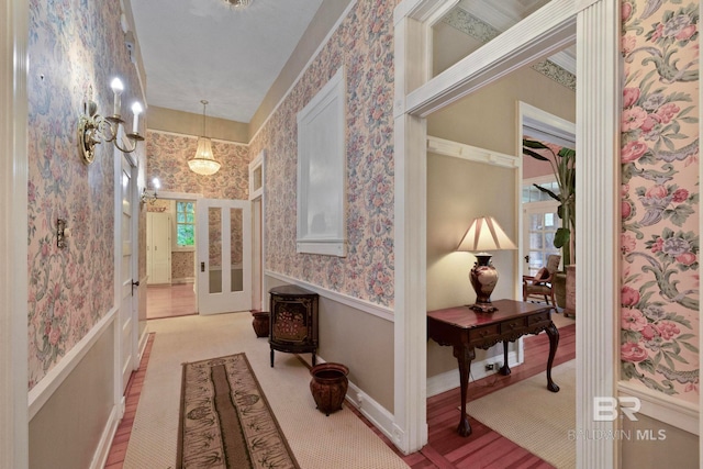 hallway with light hardwood / wood-style floors