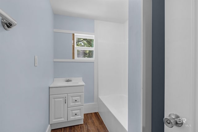 bathroom featuring vanity and wood finished floors
