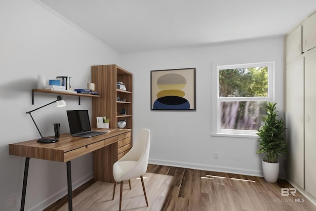 home office featuring baseboards, ornamental molding, and wood finished floors
