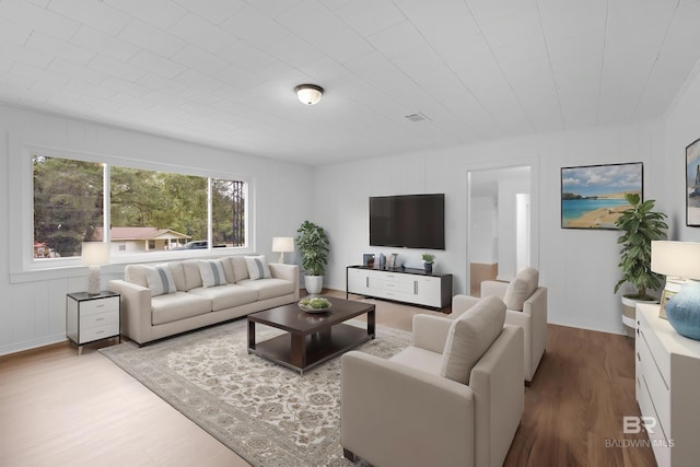 living room with visible vents and wood finished floors