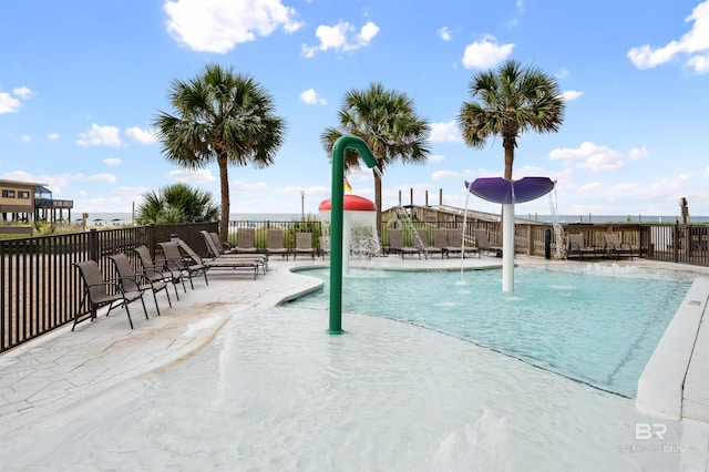 view of swimming pool with a patio area and pool water feature