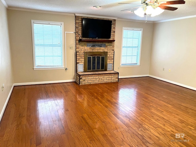 unfurnished living room with a fireplace, a textured ceiling, ceiling fan, and wood-type flooring