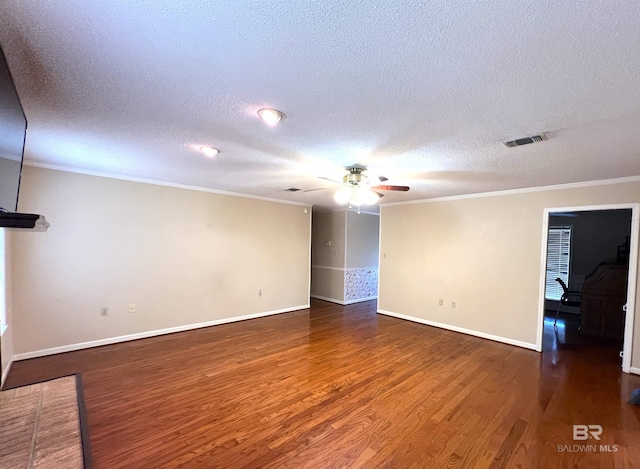 empty room featuring a textured ceiling, ceiling fan, ornamental molding, and dark hardwood / wood-style floors